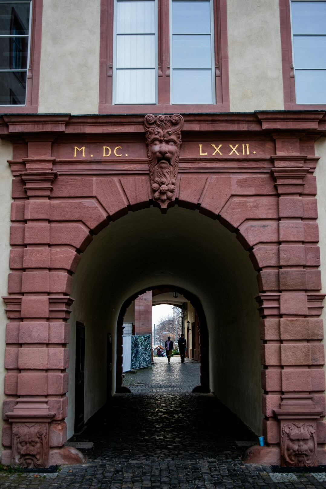 Tourists walking through the old streets of a European city