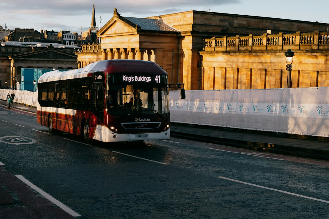 Public bus driving along a city road