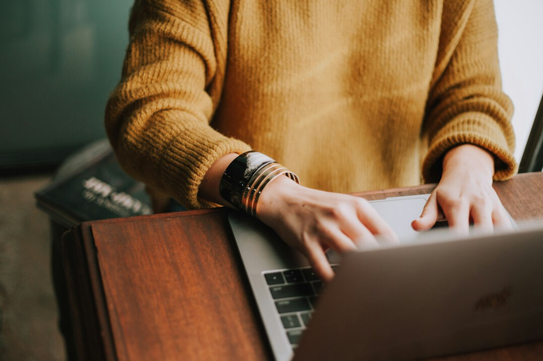 person using laptop for research