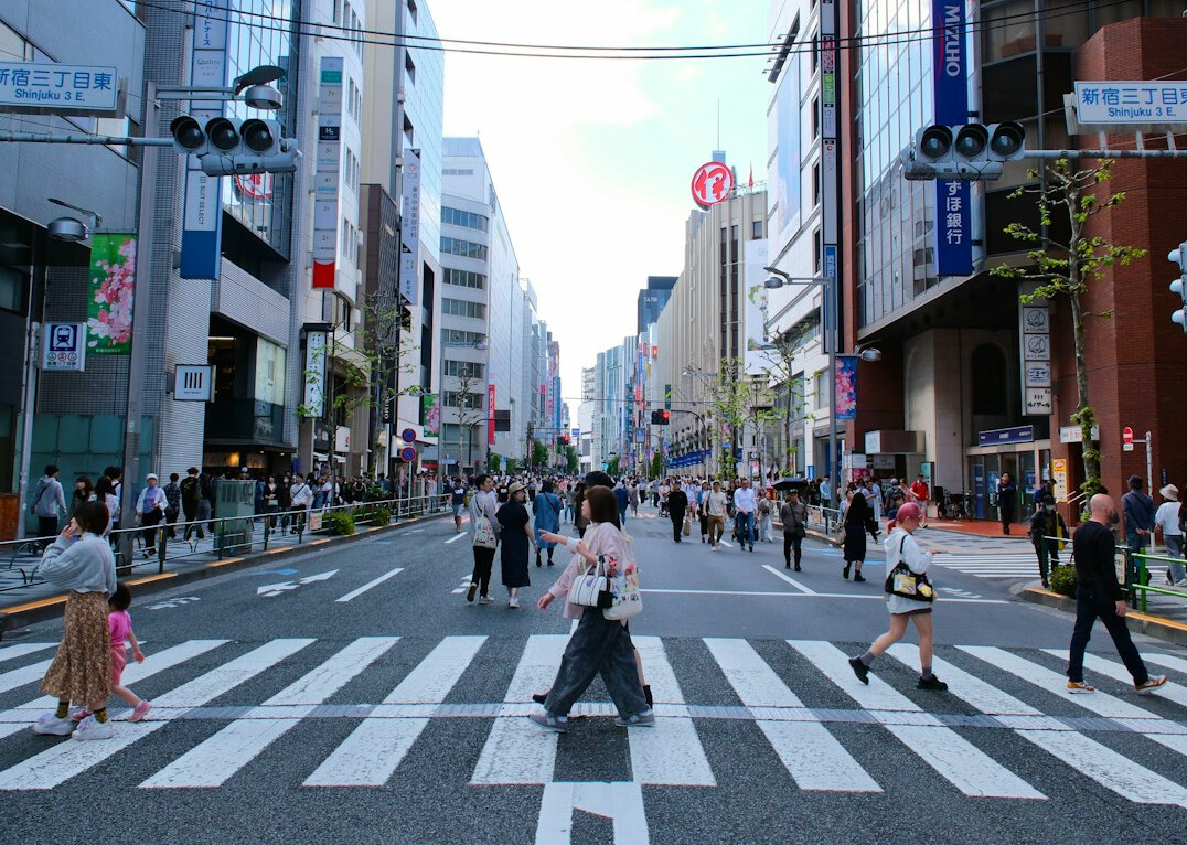 Busy city street with pedestrians and public space